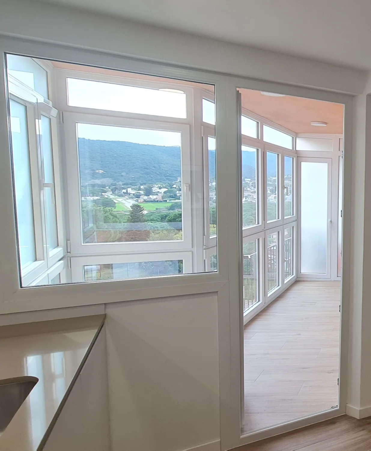 Enclosed balcony with aluminium glazing and views of Les Gavarres